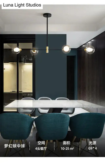 Modern black and brass metal island pendant with four glass bulbs and chain cord length for dining room chandelier