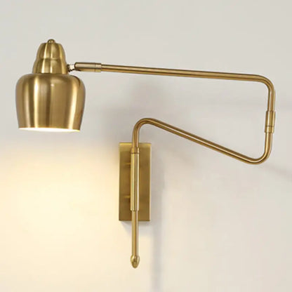 Brass-finished adjustable wall sconce with sleek articulated arm and cylindrical lamp head featuring retractable arm design