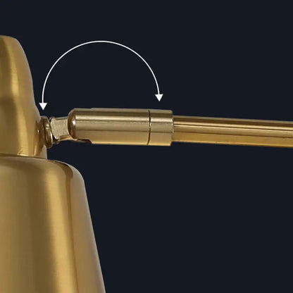 Modern black and brass retractable arm reading lamp with gold-finished brass arm and adjustable joint mechanism
