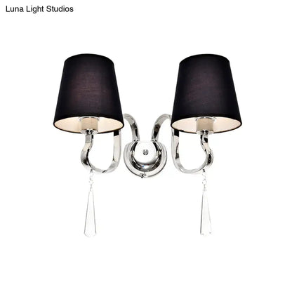 Modern black and chrome wall mount light with double-arm design, fabric shades, and crystal teardrop pendants for bedroom