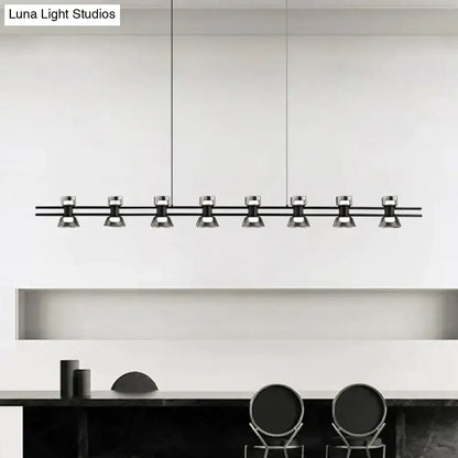 Modern black and chrome linear led strip lamp with eight sleek metallic spotlights for kitchen island lighting