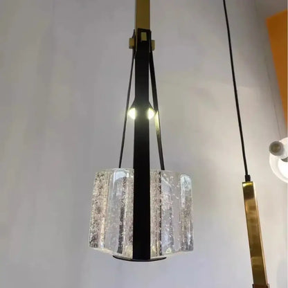 Modern pendant light with clear white resin textured glass shade and black leather straps for kitchen lighting