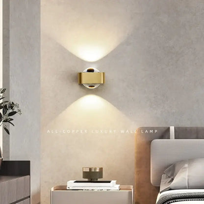 Modern black and copper bedroom wall lamp with gold-colored all-copper design and dual upward-facing light beams decorbites copper bedroom wall