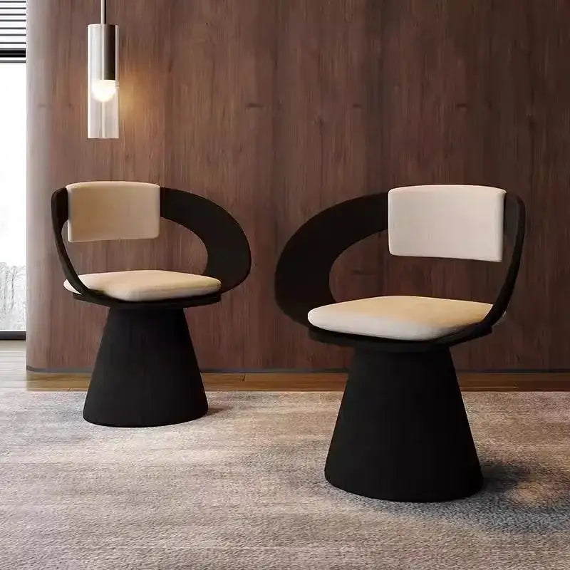 Modern black and cream upholstered elegant rotating chair with sleek curved frames for bedroom makeup stool