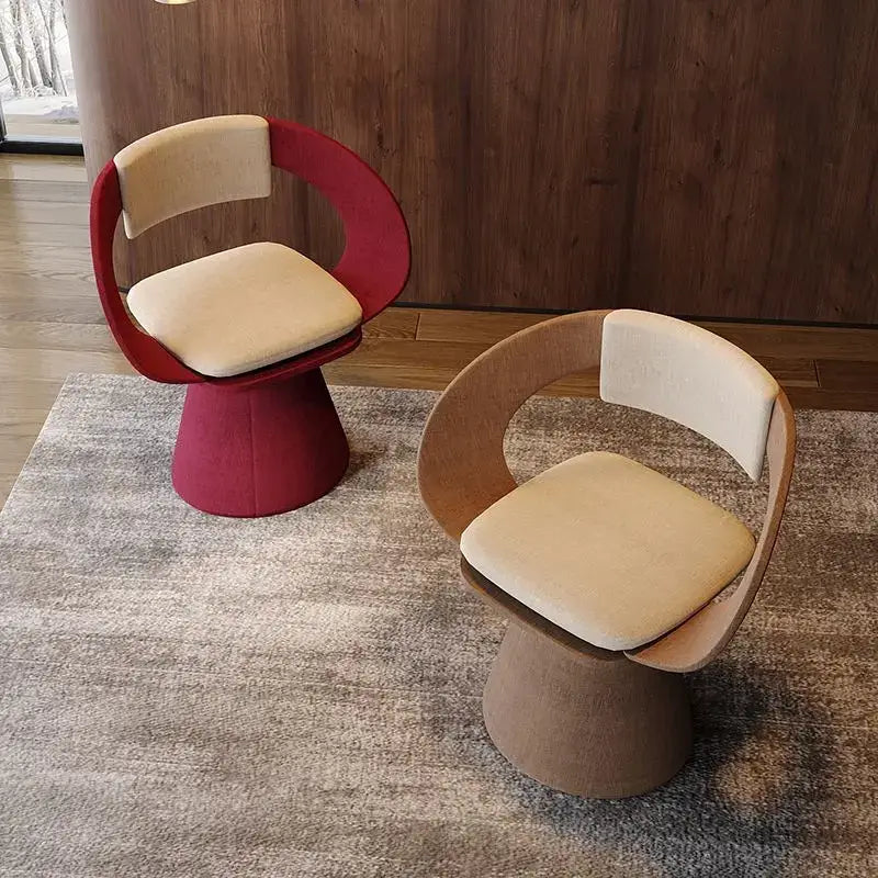 Modern elegant rotating chairs with curved frames in vibrant red and natural wood tones with cream upholstery