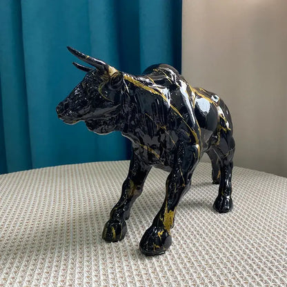 Modern black and gold decorbites bull statue ceramic figurine with glossy finish and marble-like streaks for living room decor