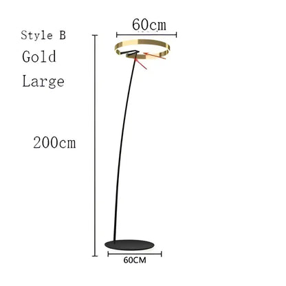 Modern black and gold floor lamp with sleek curved stem and circular head in decorbites circular luminescence led design