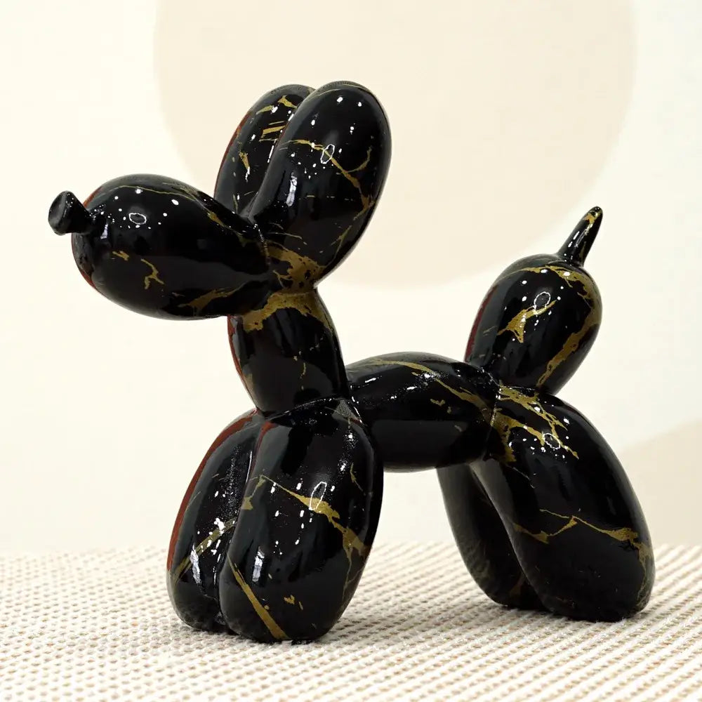 Modern black and gold crackle balloon dog sculpture with marble-like veining for living room decor