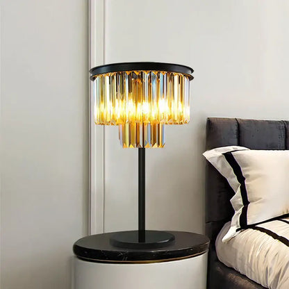 Modern black and gold crystal floor lamp with a metal base and cascading glass prisms for living room decor