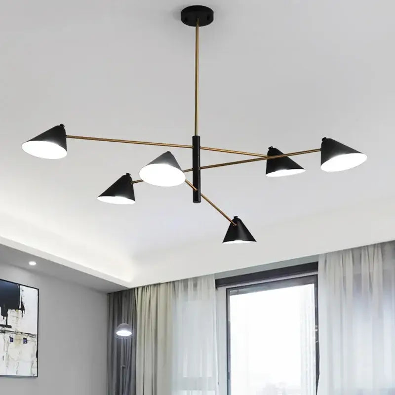 Modern black and gold decorbites cone shade chandelier with brass-toned arms and black rod for dining room lighting