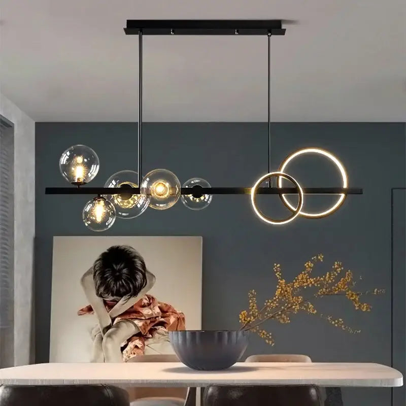 Modern black and gold glass ball pendant chandelier featuring clear glass spheres and glowing rings for kitchen decorbites glass ball lighting