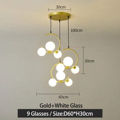 Modern black and gold glass ball pendant light with nine white glass globes and curved metallic rings for living room decorbites glass ball pendant