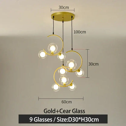 Gold-toned modern pendant light with nine clear glass ball bulbs in an elegant swirling design for living room decorbites glass ball pendant