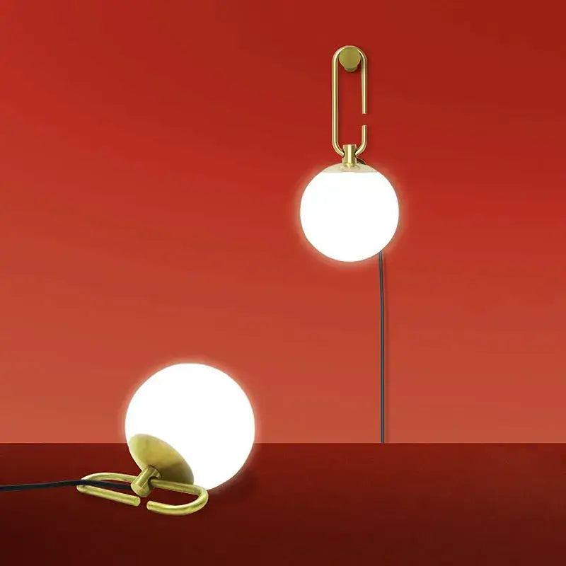 Modern black and gold glass ball pendant lights with gold-toned spherical design for dining room decorbites glass ball pendant