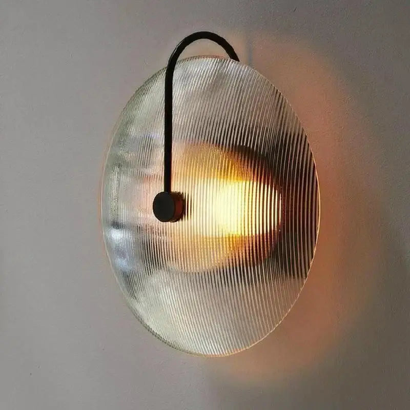 Modern black and gold glass stripe wall lamp with translucent ribbed glass shade and sleek black metal arm for decorbites glass stripe lighting