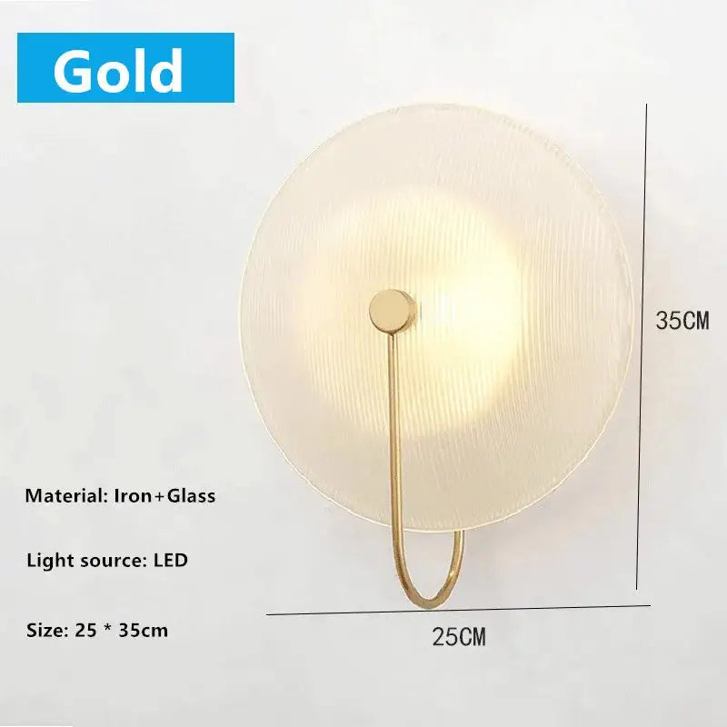Modern black and gold decorbites glass stripe wall lamp with gold-toned iron frame and circular textured glass diffuser