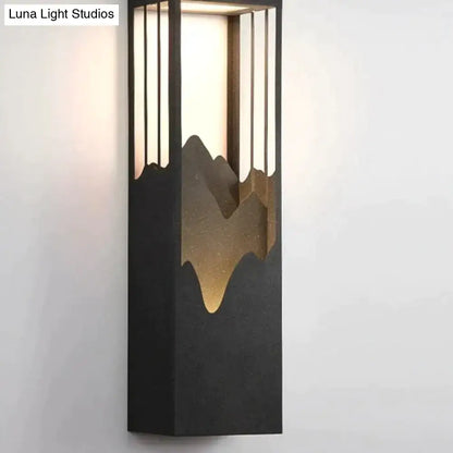 Modern black and gold mountain solar led outdoor light garden sconce with vertical slats for outdoor illumination