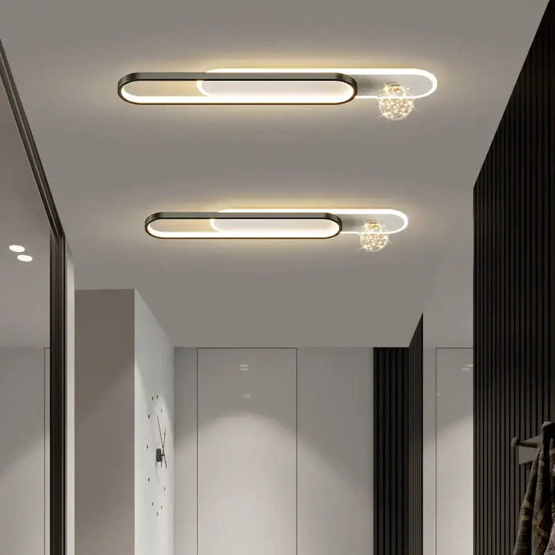 Modern black and gold starry strip flush mount bedroom light features minimalist ceiling lights with sleek black frames and crystal orbs