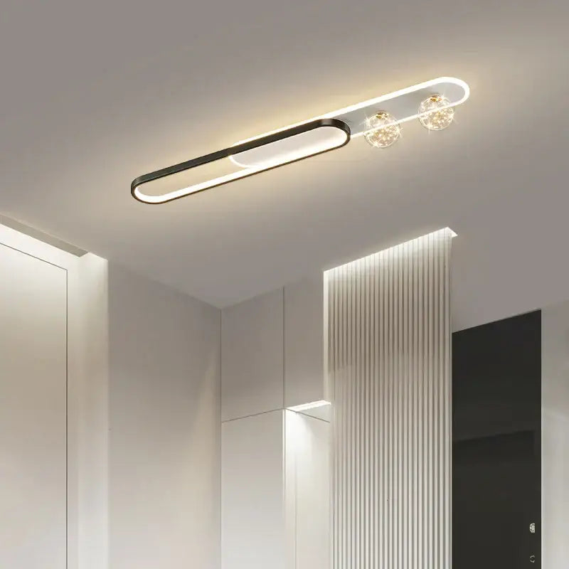 Modern black and gold starry strip flush mount bedroom light with a minimalist black and white design and crystal accents