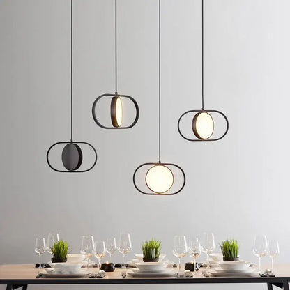 Modern black and gold trumpet pendant light with circular illuminated glass panels for dining room decorbites gold trumpet