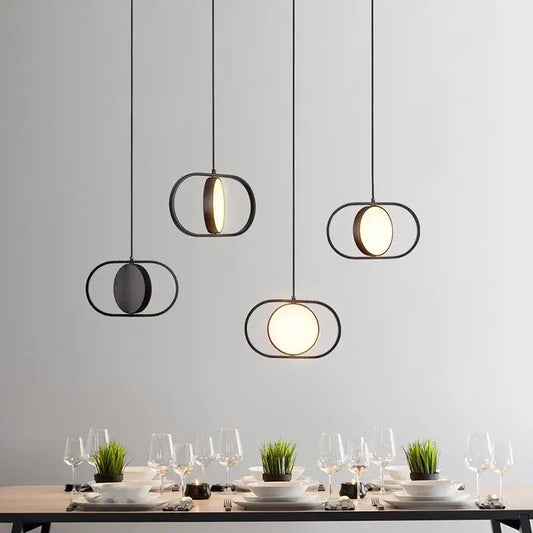 Modern black and gold trumpet pendant light with circular illuminated glass panels for dining room decorbites gold trumpet
