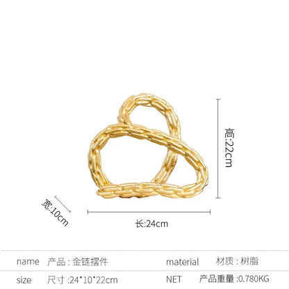 Gold-colored braided knot chain pendant with a twisted knot design for modern black and golden knot chain living room decor