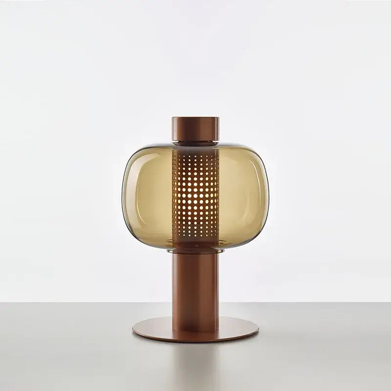 Modern black and gray glass table light with translucent amber shade and copper base, perfect for bedroom bedside decorbites table light