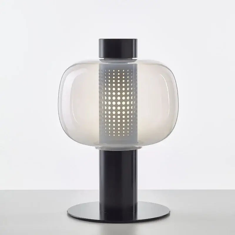 Modern black and gray glass table light with a frosted globe and perforated panel for bedroom decorbites table light