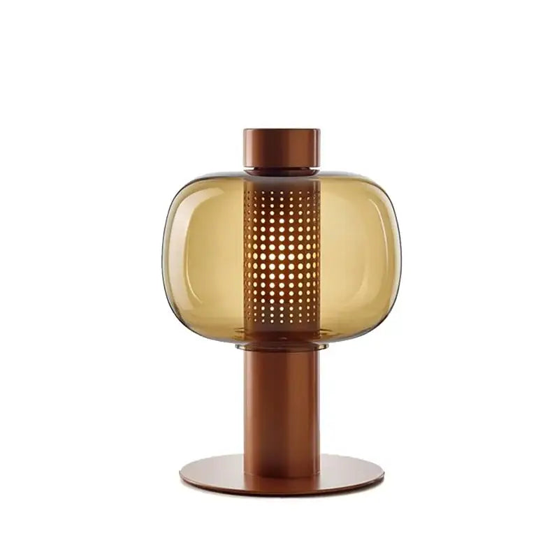 Modern black and gray decorbites glass table light with sleek amber glass and copper-toned perforated metal base