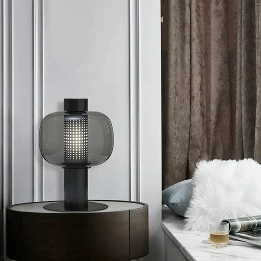 Modern black and gray glass table light with sleek base and perforated shade ideal for bedroom bedside decorbites table light