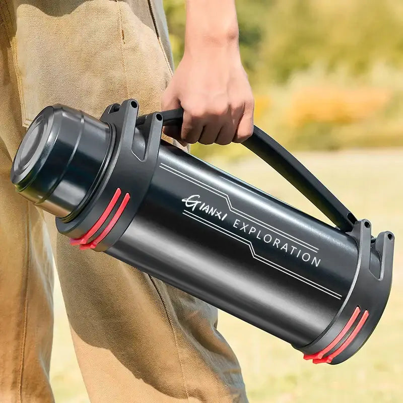 Modern black and red stainless steel thermos bottle with gianxi exploration branding and sturdy handle travel kettle design
