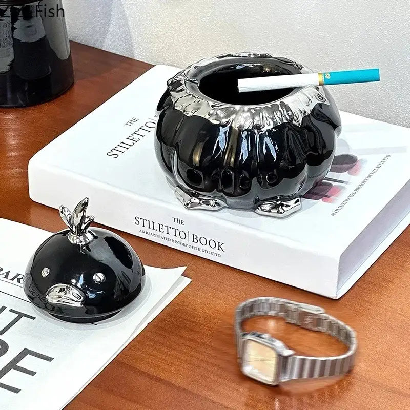 Modern black and silver duck shaped ceramic ashtray with glossy pumpkin shape and metallic rim for living room decorbites duck shaped