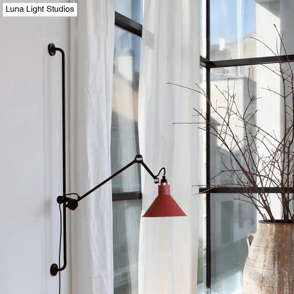 Red conical shade modern wall-mounted lamp with black articulated arm and base for direct wired electric use