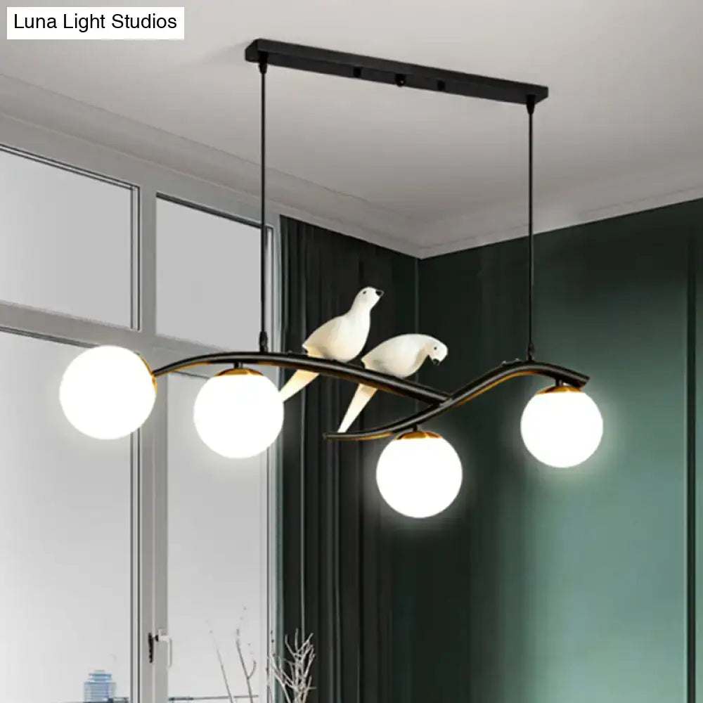 DecorBites™ modern black metal dining room island light pendant with three white glass bulbs, sculpted birds, and adjustable cord length