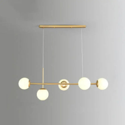 Modern black and white bird linear island pendant light with gold-toned frame and five frosted glass shade bulbs