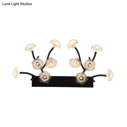 Modern black metal wall light with blossom clear glass flower fixtures for bedroom decor