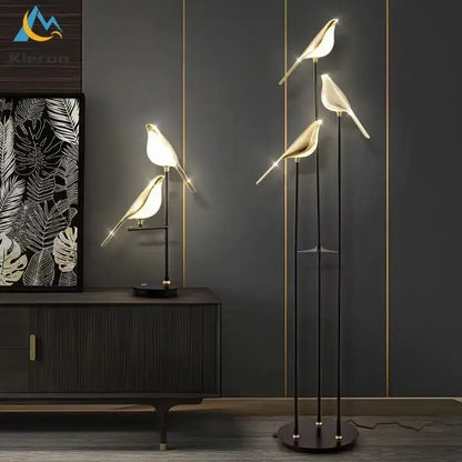 Modern black and white crow led floor lamp with sleek black metal legs and glowing translucent glass for living room decorbites crow led