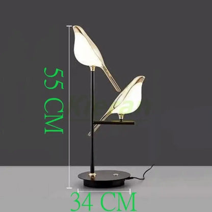 Modern black floor lamp with two illuminated bird-shaped shades and gold trim decorbites crow led floor detail