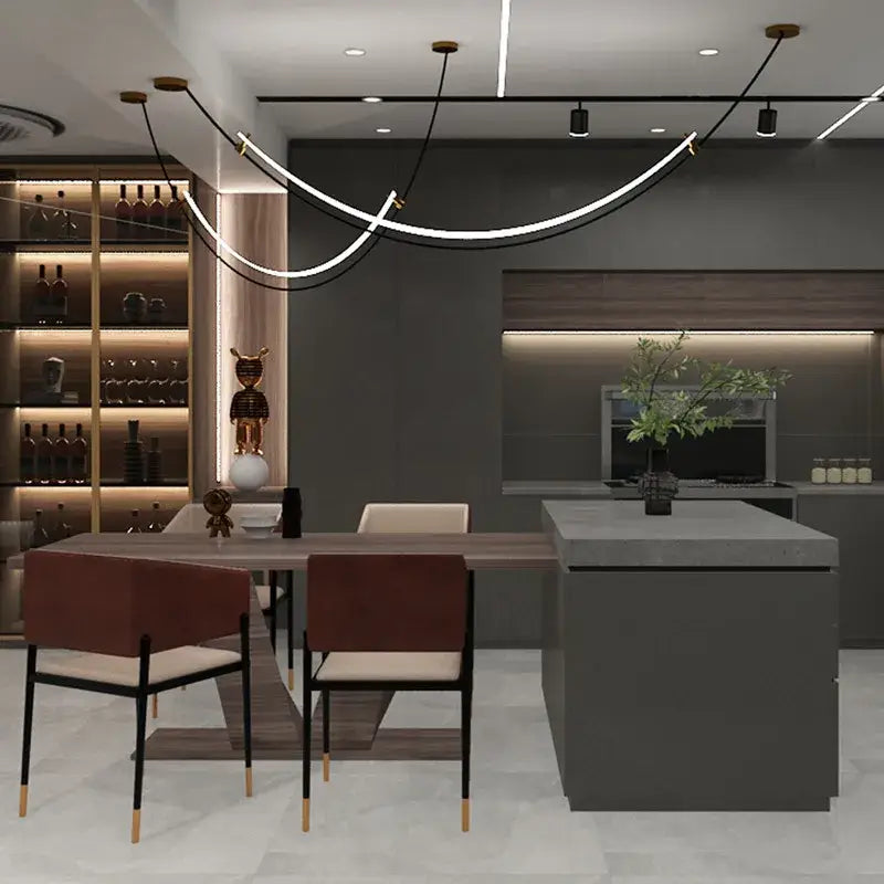Modern black and white designer arc line dining room chandelier above minimalist kitchen island with sleek gray countertop and dark wood cabinetry decorbites designer arc