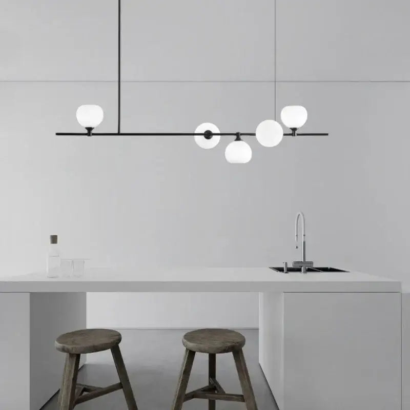 Modern black metal pendant lamp with five frosted white glass globes for dining room lighting