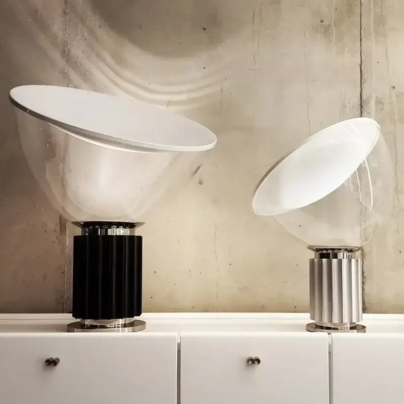 Two modern black and white glass radar shade led desk lamps with transparent domes and fluted metallic bases for bedroom use