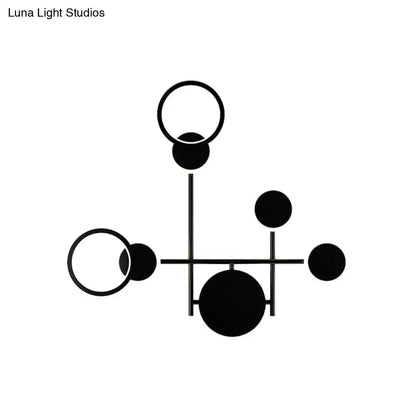 Modern black and white metallic round led wall sconce with geometric circular led wall elements for living room lighting