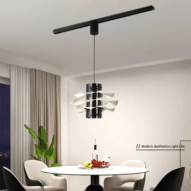 Modern black and white petal pendant lamp with sleek cylindrical body and wave-like arms for decorbites designer restaurant