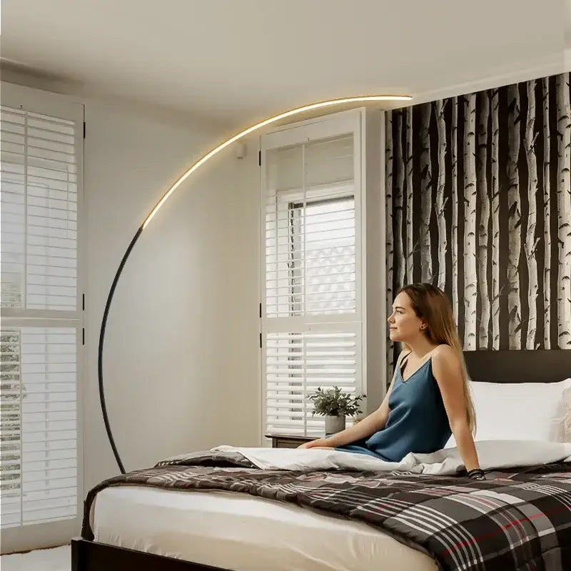 A sleek modern black arc rgb led floor lamp with curved design and warm lighting for living room decorbites decor