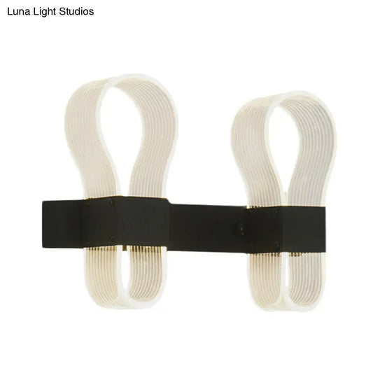 Modern black arc ring wall lamp with two curved off-white acrylic arms and a sleek black metal arc ring sconce design