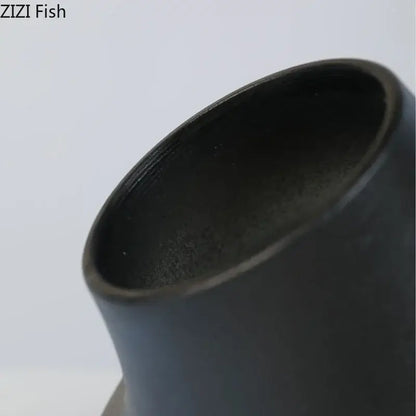 Modern black bell shaped decorbites ceramic vase with smooth matte finish and flared rim for desktop decor