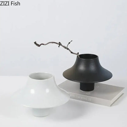 Modern black bell shaped decorbites ceramic vase with wide flared top and narrow base for desktop decor