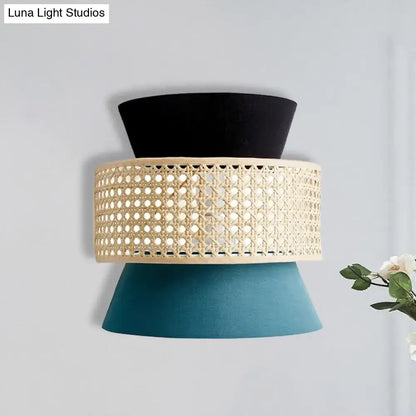 Modern black and blue rattan dual cone wall lamp with black cream woven cane band and teal fabric shades bedroom sconce