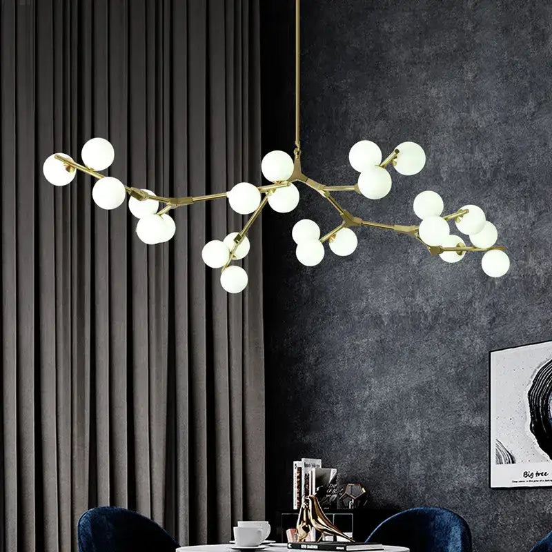 Gold-toned branch-style pendant lights with frosted decorbites glass balls led bulbs for modern living room decor