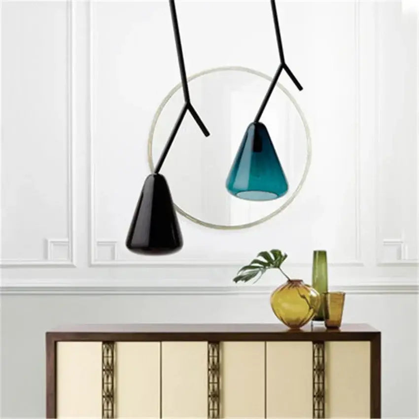 Modern black branching glass pendant lights with sleek metal arms and conical matte black and teal shades for dining room